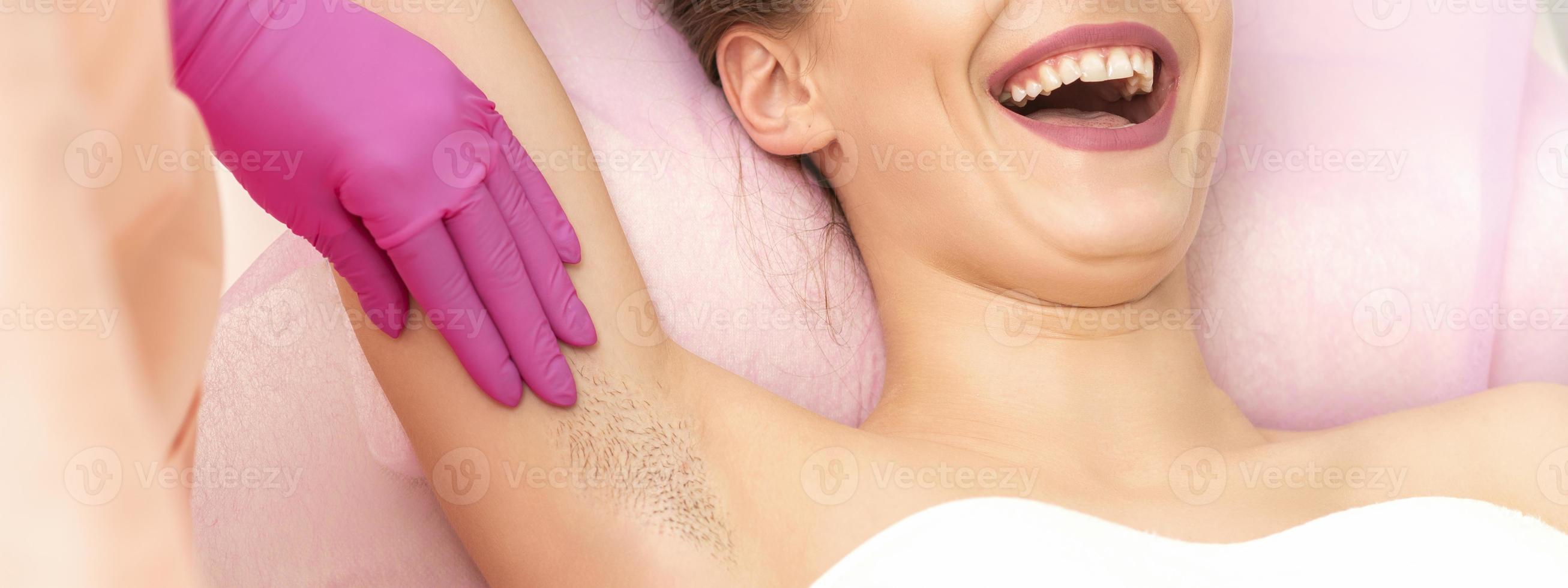 Young woman during armpit examination photo