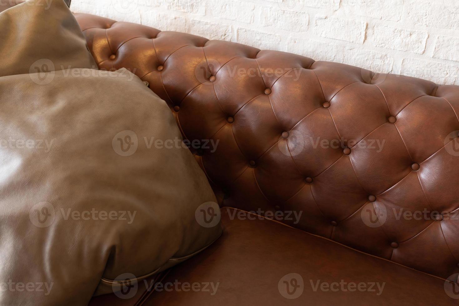 Sofa Chester in an interior. seat leather sofa. Selective focus. photo