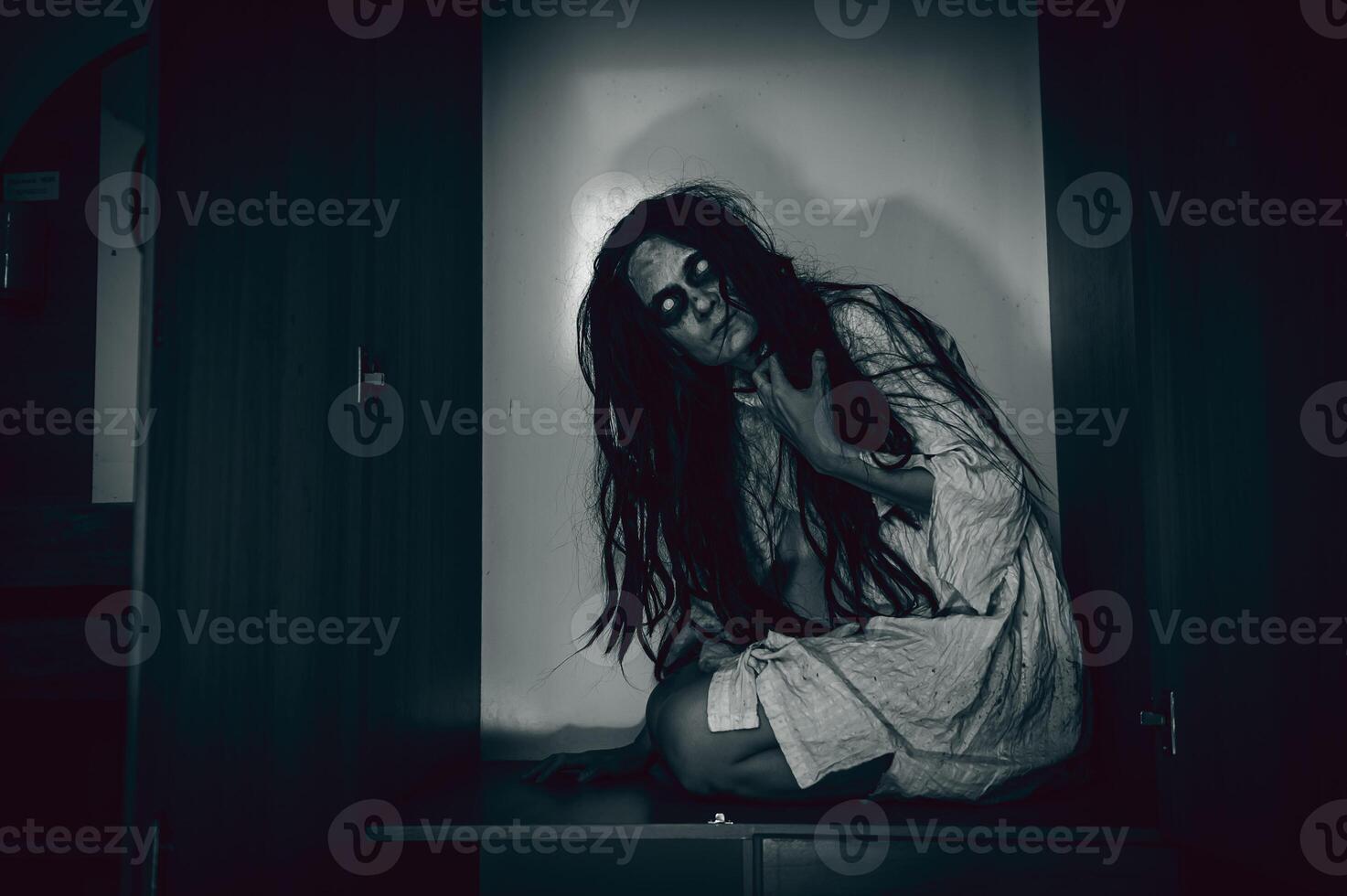 Portrait of asian woman make up ghost,Scary horror scene for background,Halloween festival concept,Ghost movies poster,angry spirit in the apartment photo