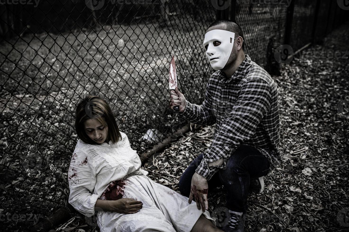 A serial killer scene is about to kill an Asian woman,concept thriller scene,Halloween festival photo