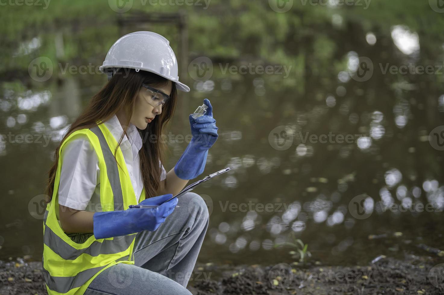 Environmental engineers inspect water quality,Bring water to the lab for testing,Check the mineral content in water and soil,Check for contaminants in water sources. photo