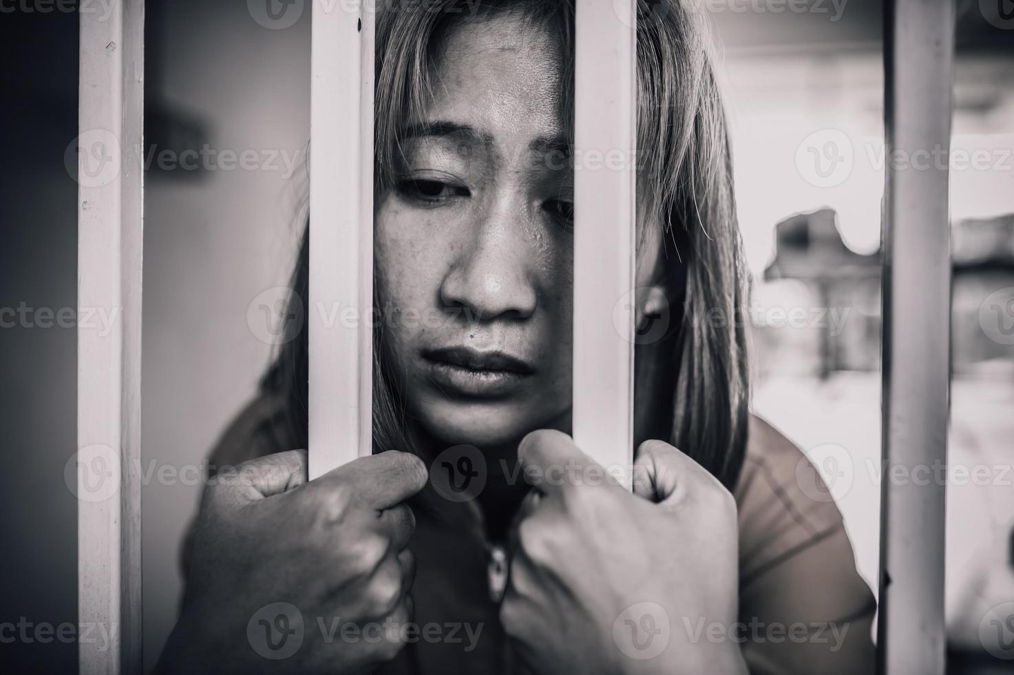 Hands of women desperate to catch the iron prison,prisoner concept,thailand people,Hope to be free,If the violate the law would be arrested and jailed. photo