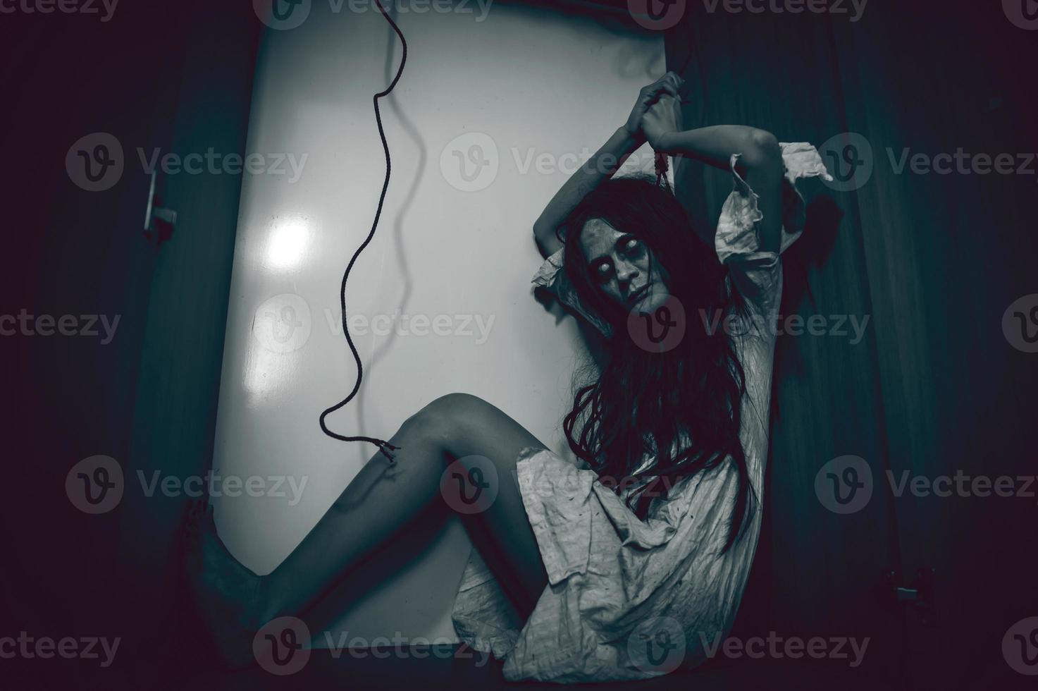 Portrait of asian woman make up ghost,Scary horror scene for background,Halloween festival concept,Ghost movies poster,angry spirit in the apartment photo