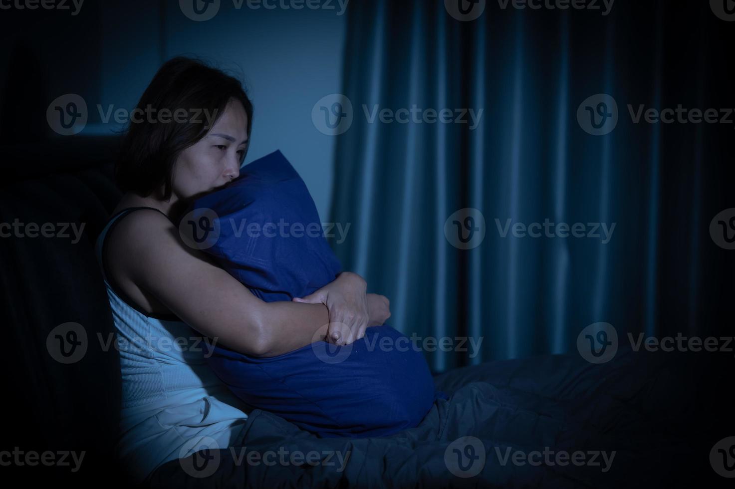 Asian women have a high concern that is why she can't sleep.Have stress from work photo