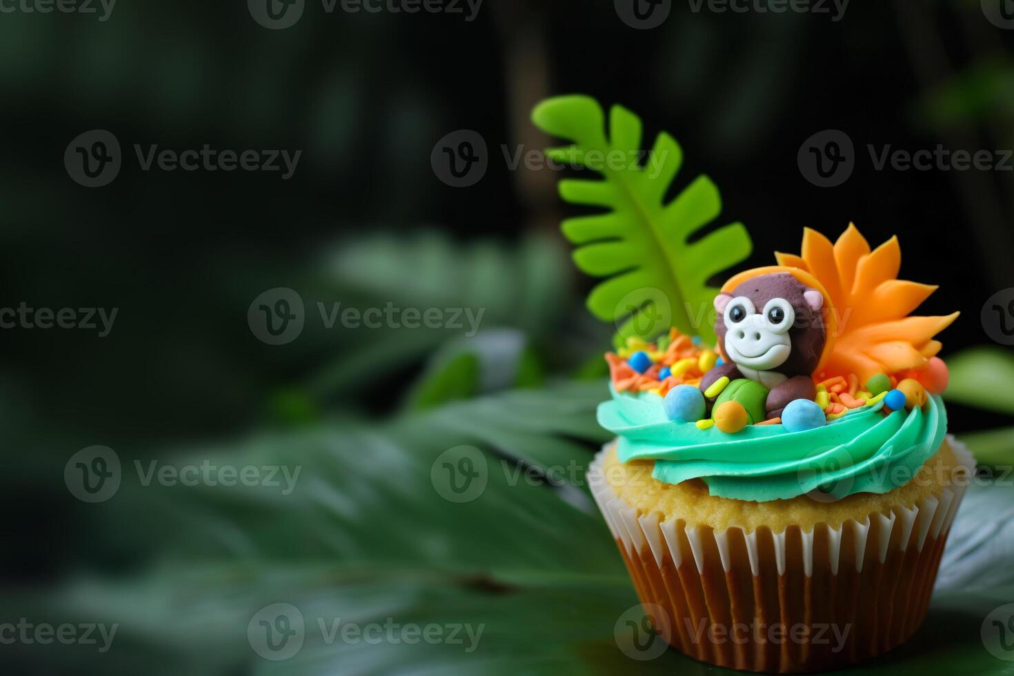 Cute cupcake for kids with copy space. Happy Birthday dessert. Children's jungle party. Empty space for text. Postcard, greeting card design. Muffin with tropical leaves and monkey. . photo