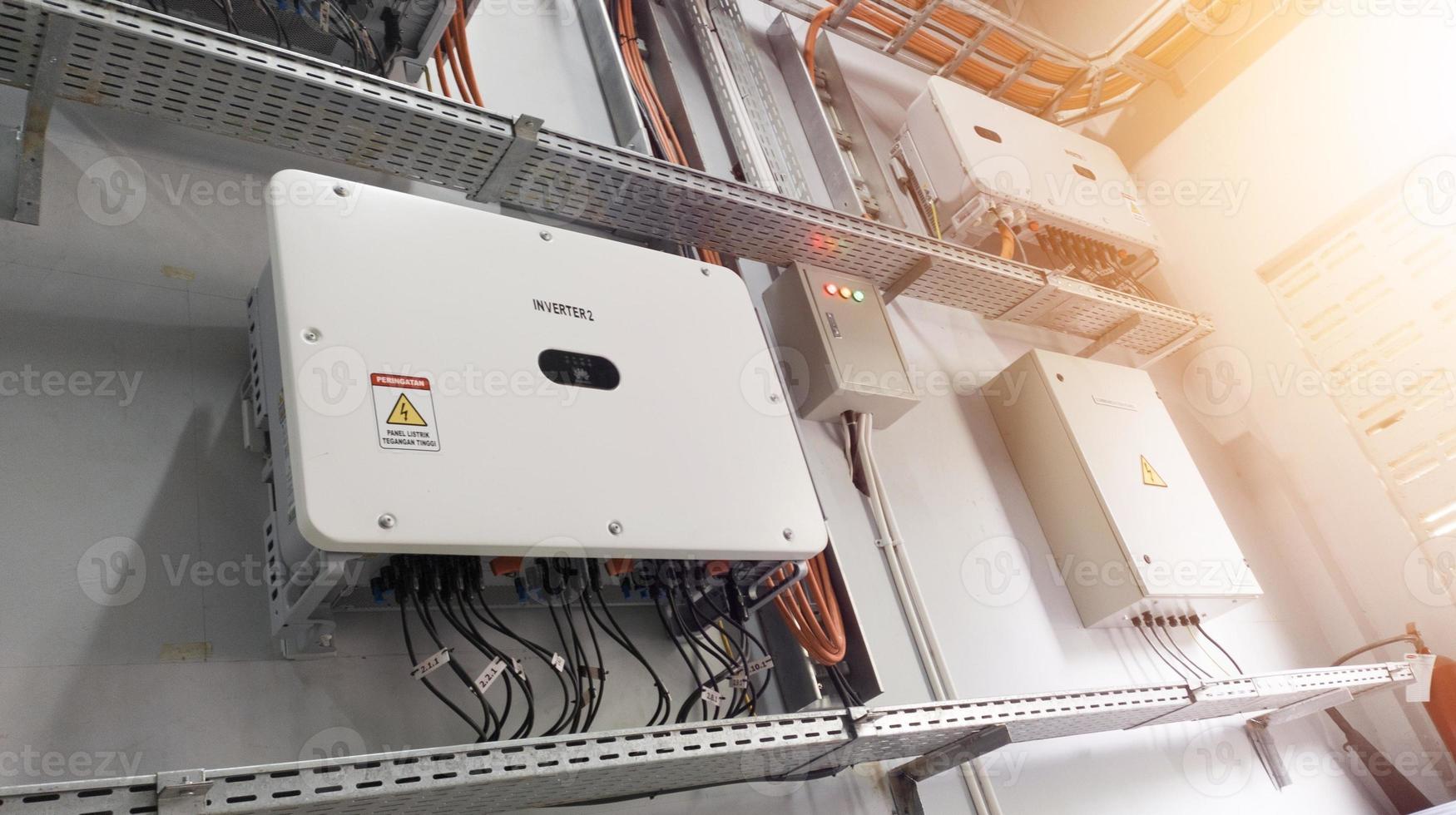 Instalation control of inverters solar panel on the wall. Technology of solar energy with shiny light. photo