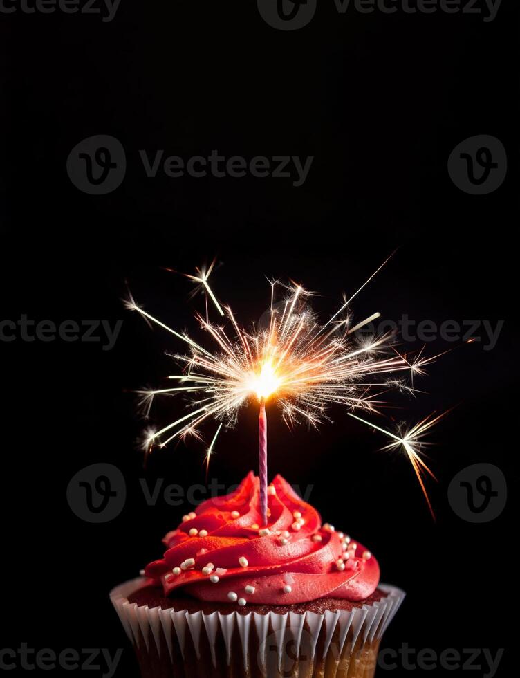 Elegant red cupcake with glitter, sparkler and copy space on black background. Happy Birthday dessert. Empty space for text. Postcard, greeting card design. . photo