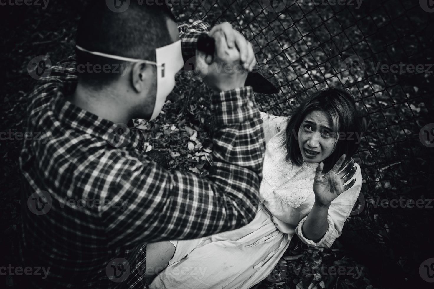 A serial killer scene is about to kill an Asian woman,concept thriller scene,Halloween festival photo