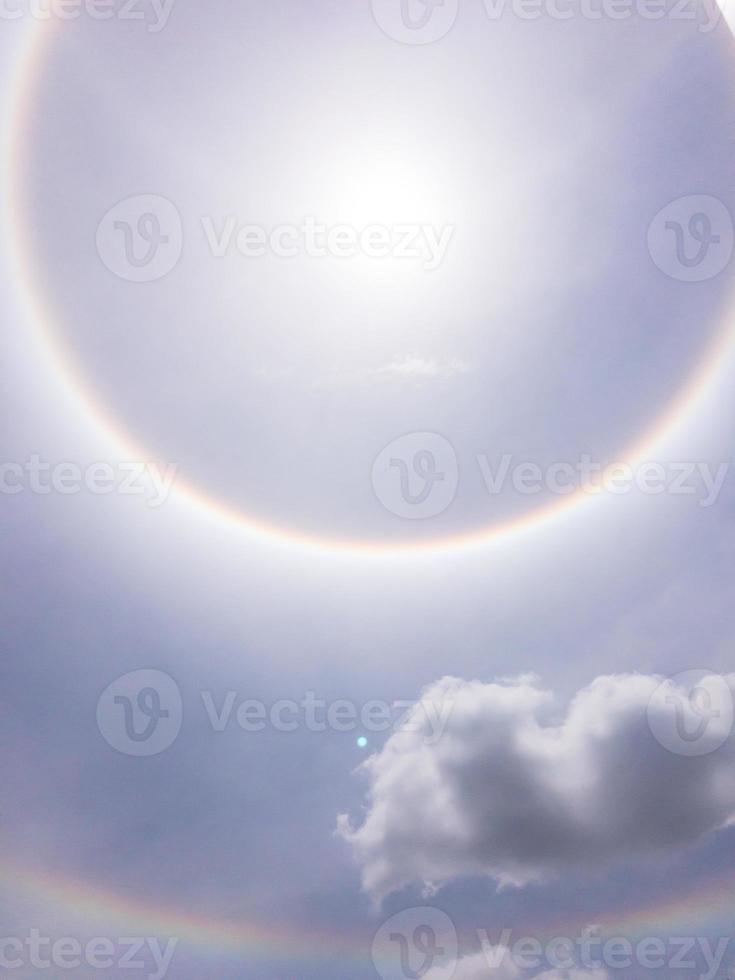 The beauty phenomenon is the sun halo on the sky at noon. photo