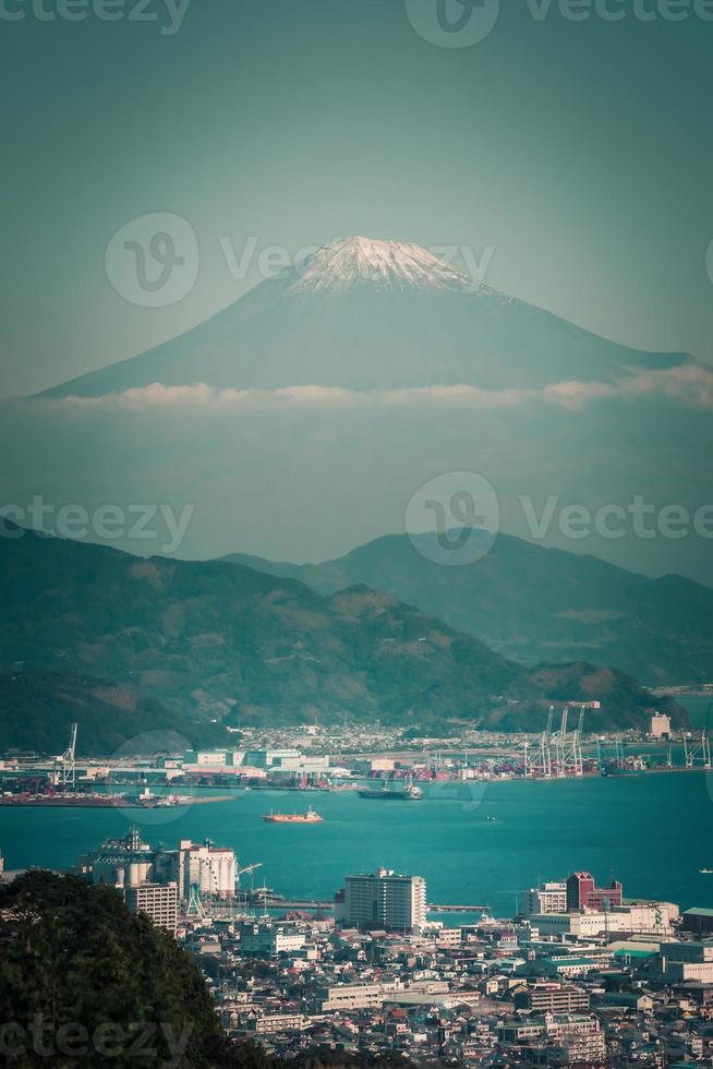 Mt. Fuji over Lake Kawaguchiko with autumn foliage at sunrise in Fujikawaguchiko, Japan. photo