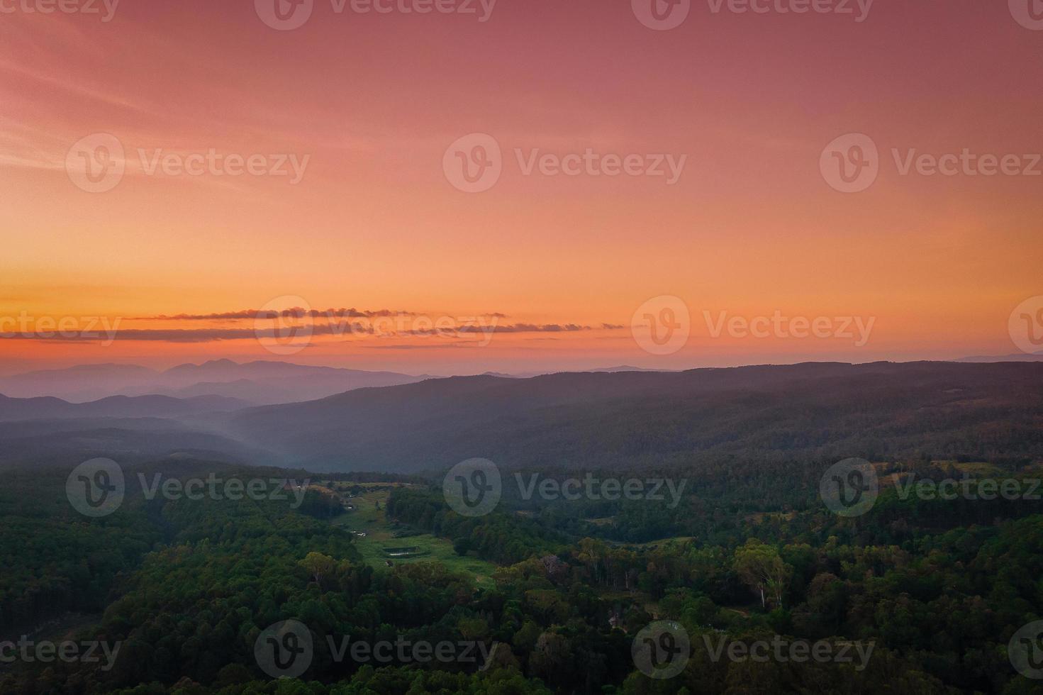 Aerial view of sunrise over mountian and pine tree in Chiang Mai Province, Thailand. photo