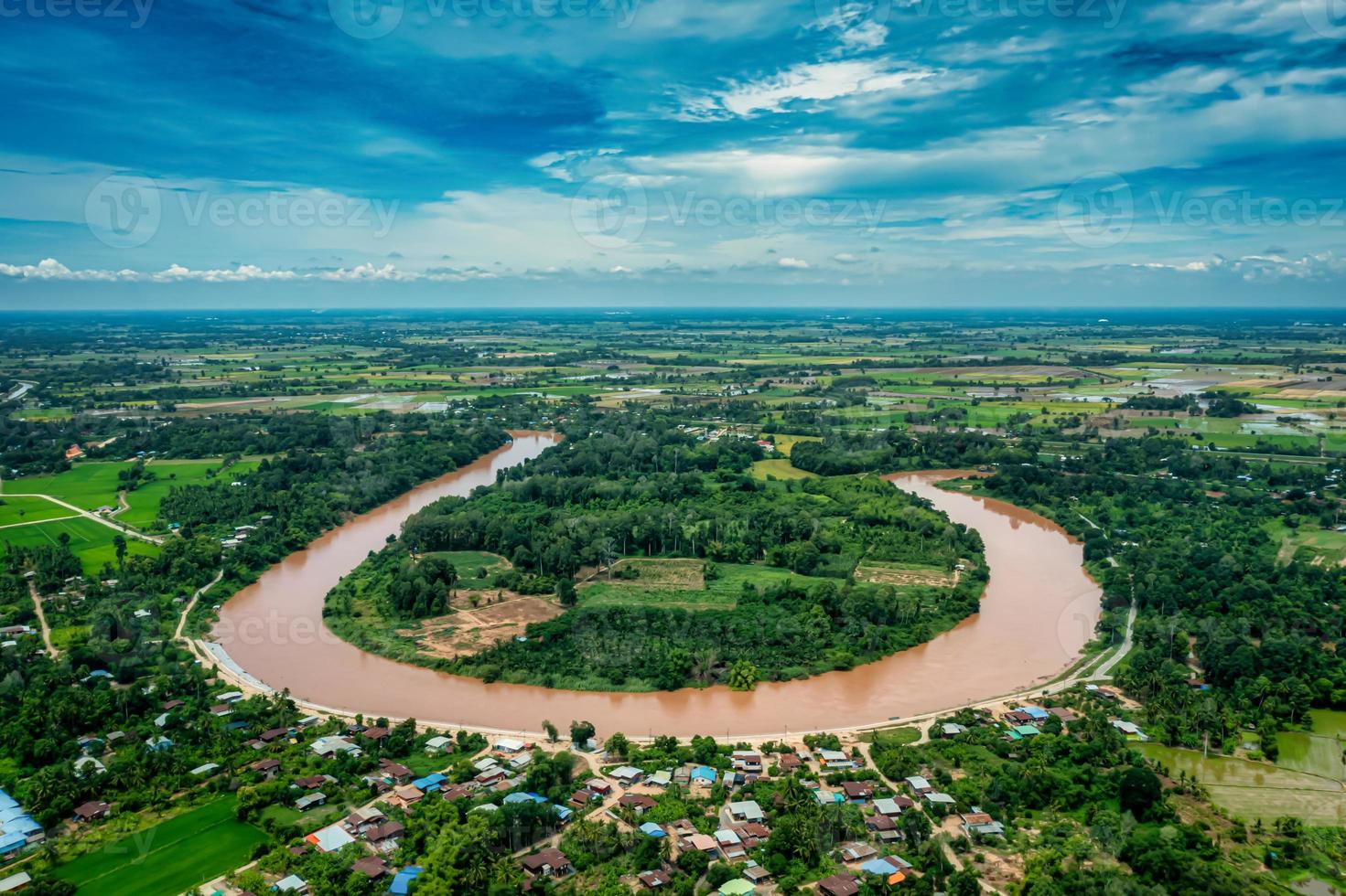 Aerial landscape of river in green field, top view of beautiful nature background from drone. photo