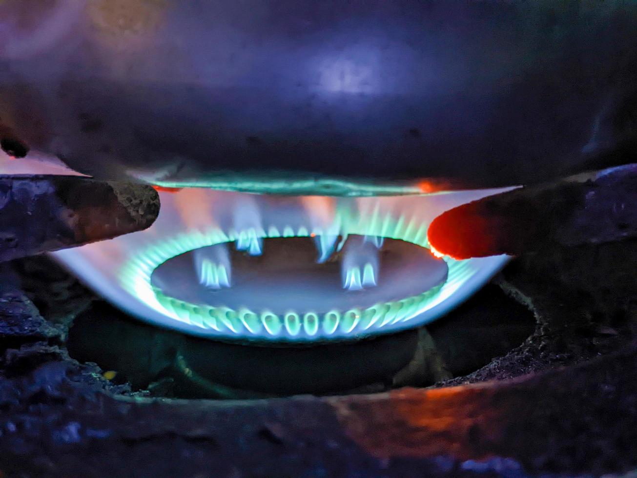 A close up of blue flame from the stove photo