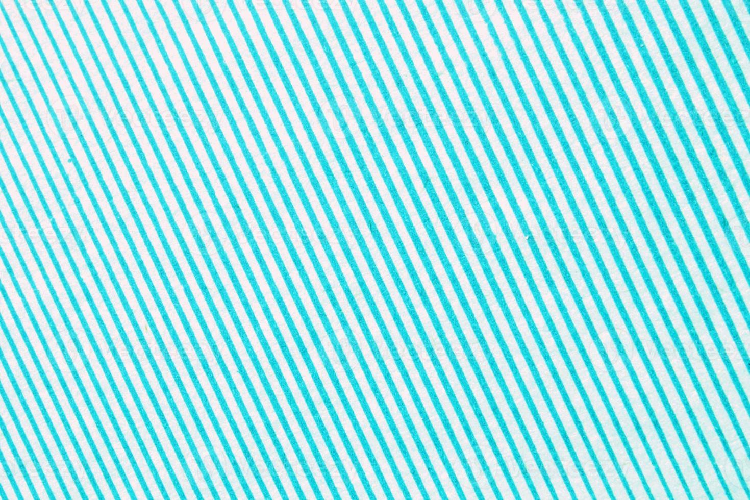 Abstract paper blue and white geometric symmetrical texture striped surface diagonal lines background. Structure design cardboard shape backdrop. Decoration interior concept. Flatlay, close-up photo