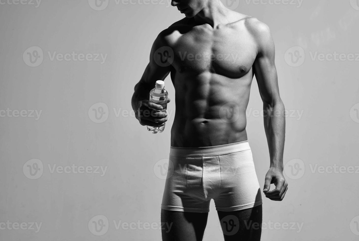 male bodybuilder in white shorts posing athlete workout photo