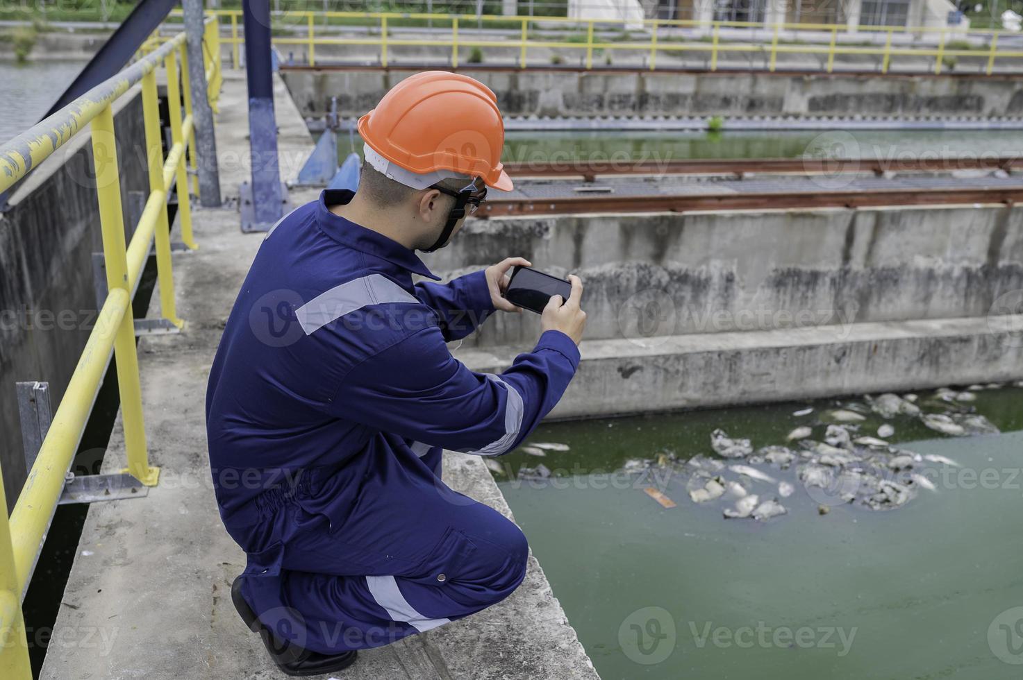 Water plant maintenance technicians, mechanical engineers check the control system at the water treatment plant. photo