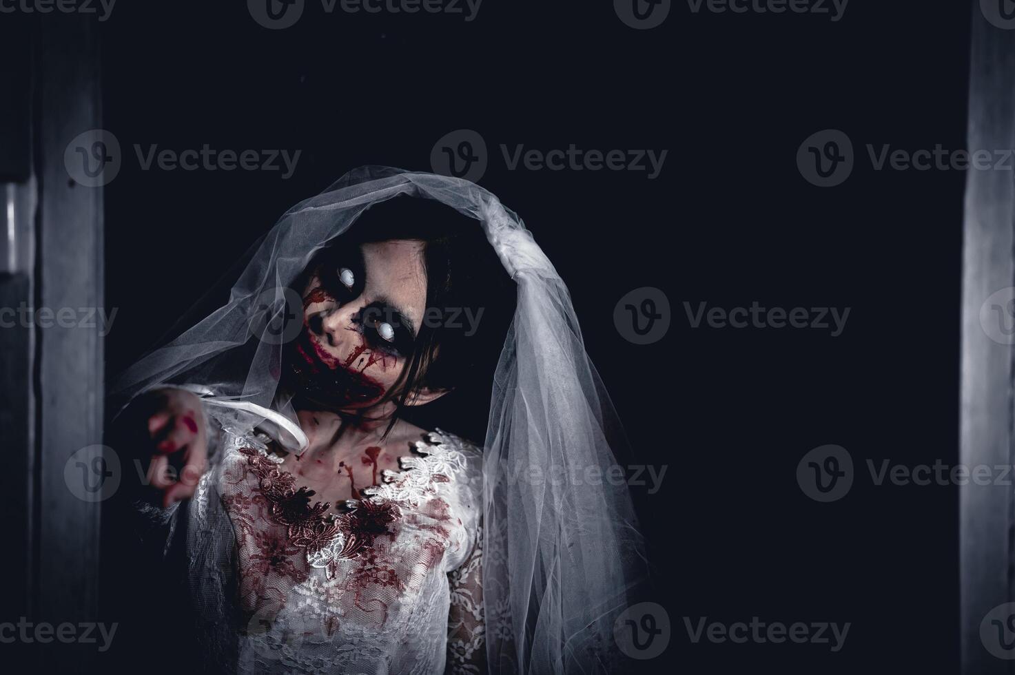 Halloween festival concept,Asian woman makeup ghost face,Bride zombie charactor,Horror movie wallpaper or poster photo