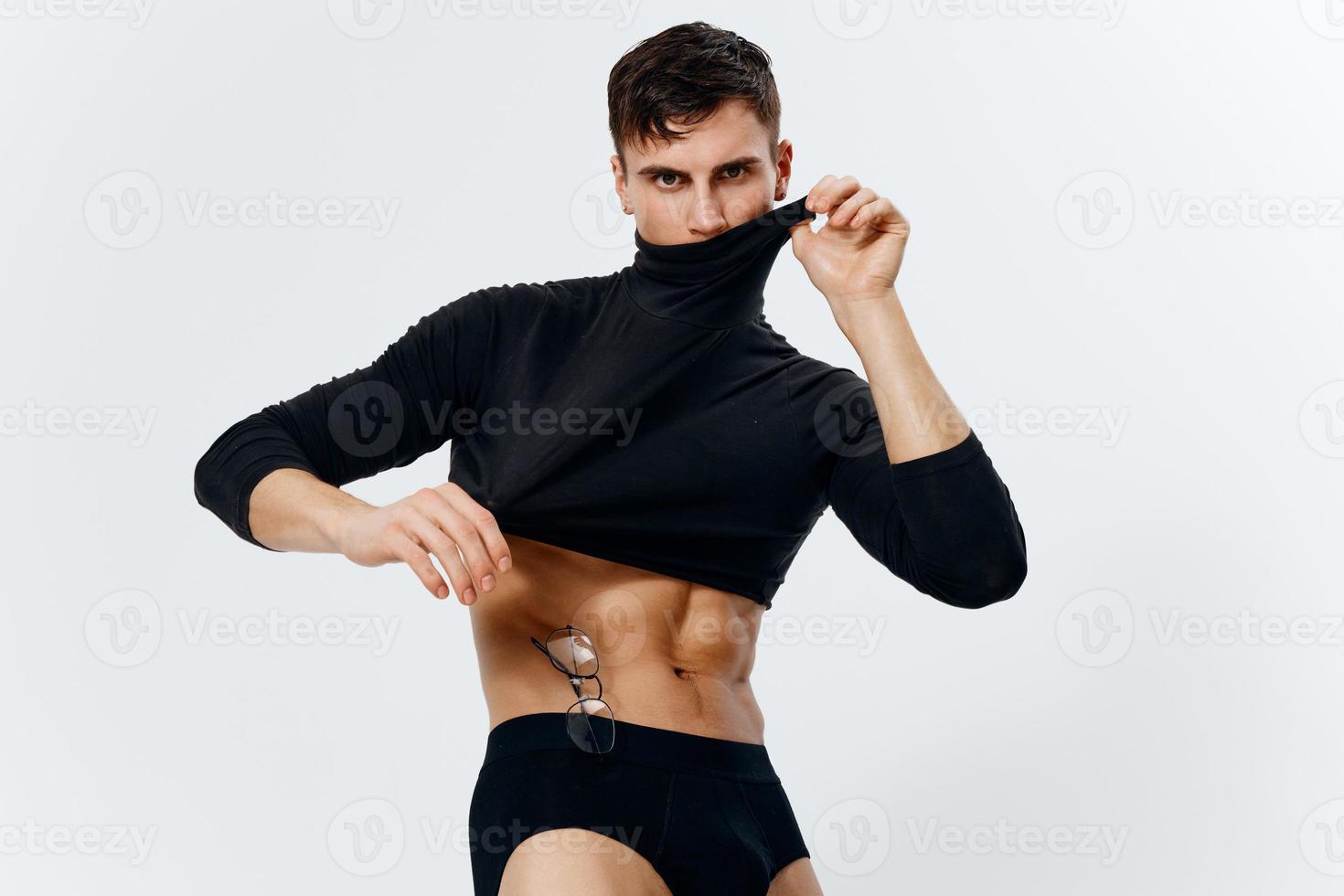 guy athlete with a pumped-up torso in a short sweater model portrait photo