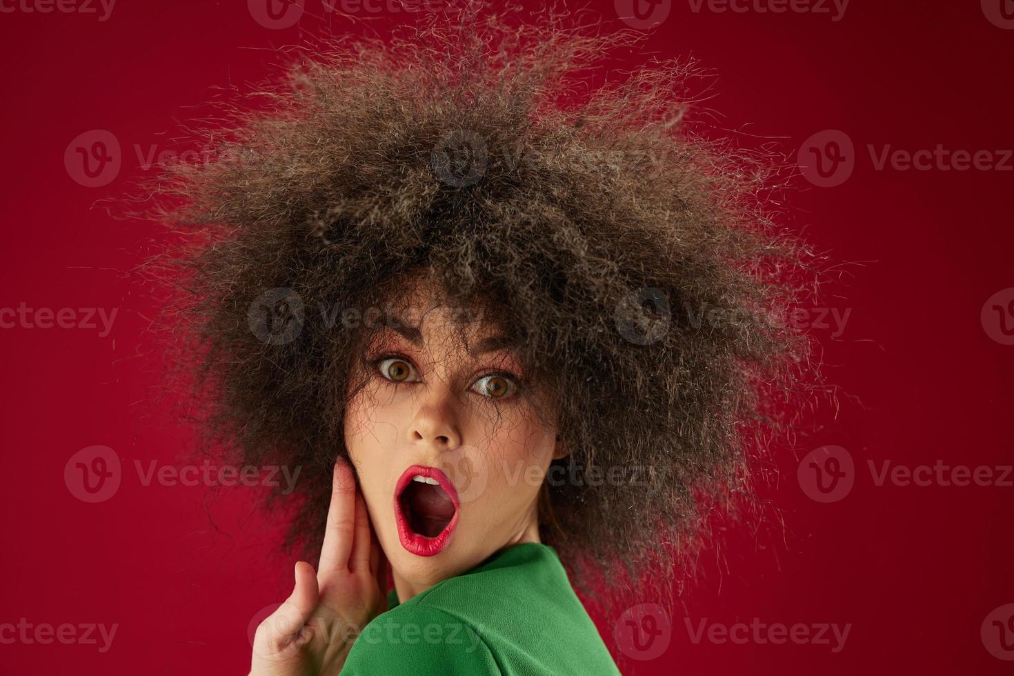 Pretty young female with curly hair grimace posing emotion color background unaltered photo