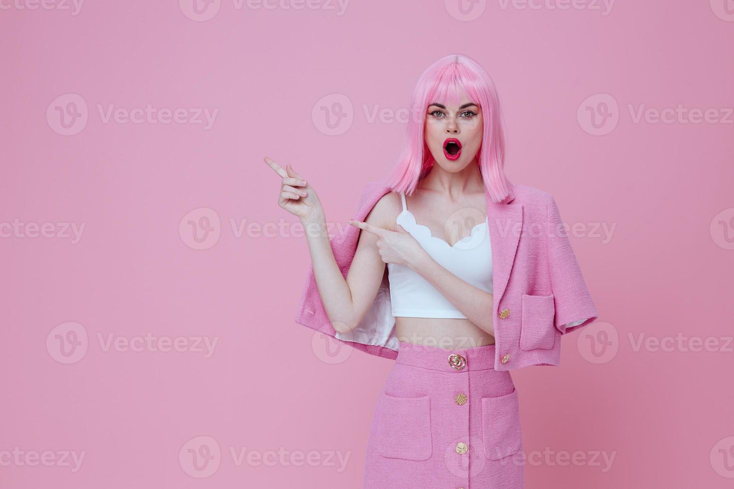 Beauty Fashion woman gestures with his hands with a pink jacket pink background unaltered photo