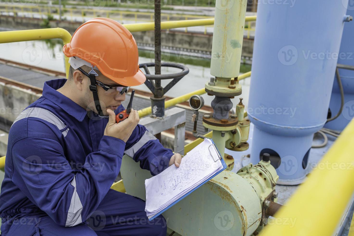Water plant maintenance technicians, mechanical engineers check the control system at the water treatment plant. photo