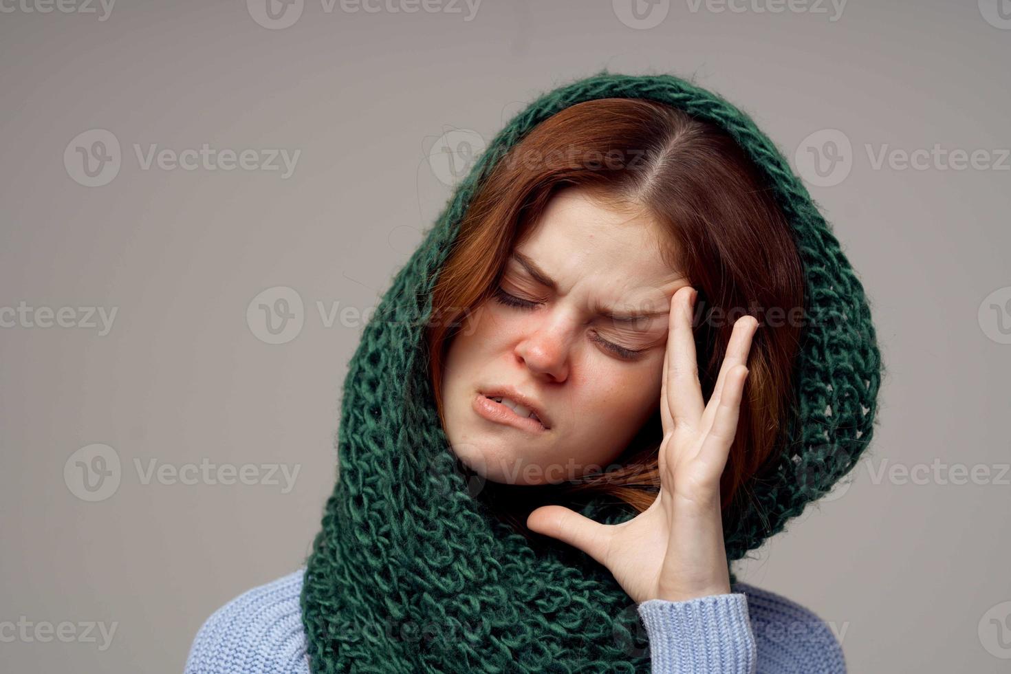 red-haired woman health problems temperature close-up photo