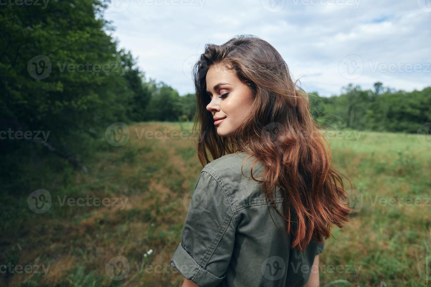Woman in the meadow Eyes closed looking towards the fresh air of lifestyle freedom photo