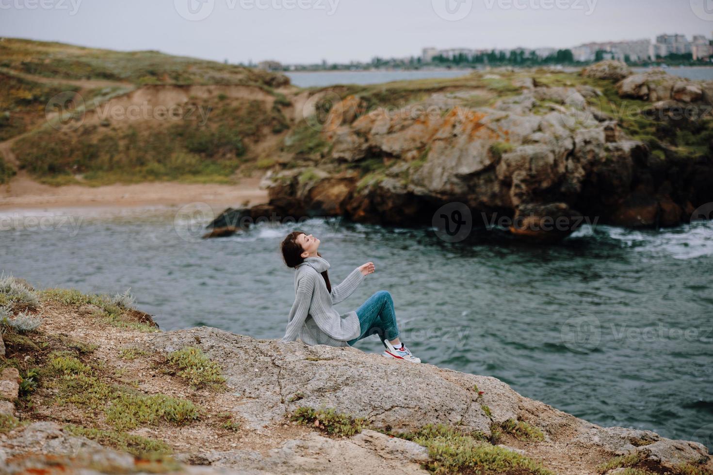 woman sweaters cloudy sea admiring nature Lifestyle photo