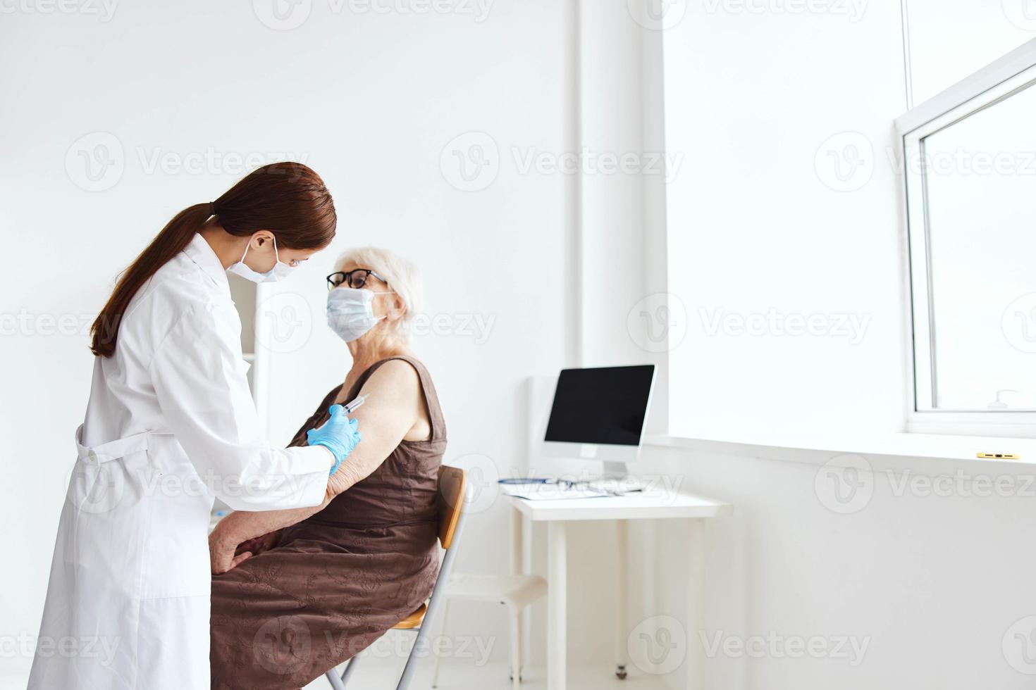 elderly woman vaccine passport hospital treatment photo