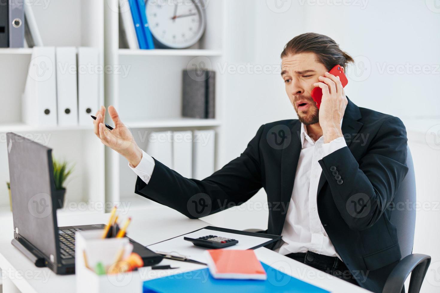 businessmen at the desk documents communication by phone technology photo