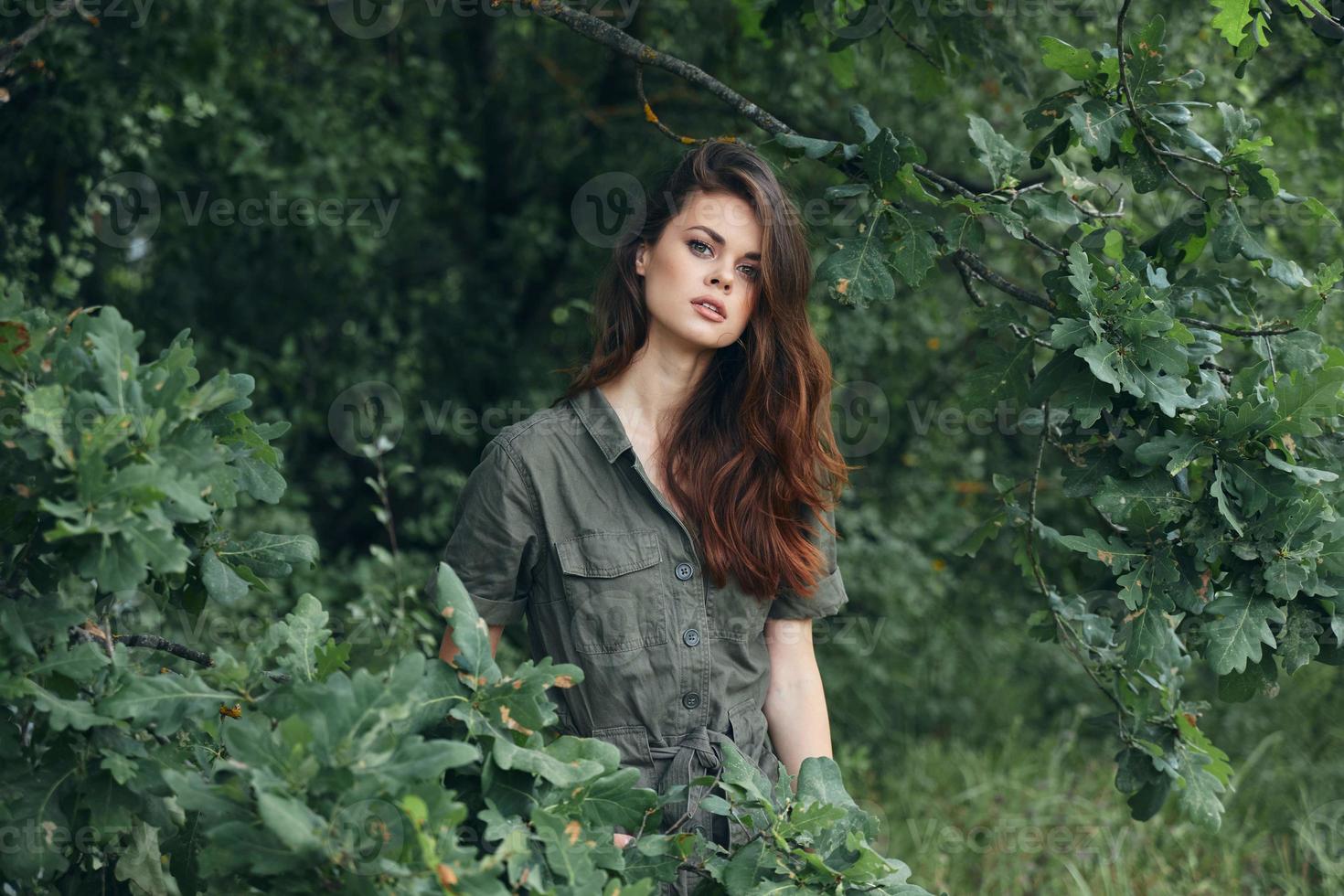 Portrait of a woman look ahead in the forest photo