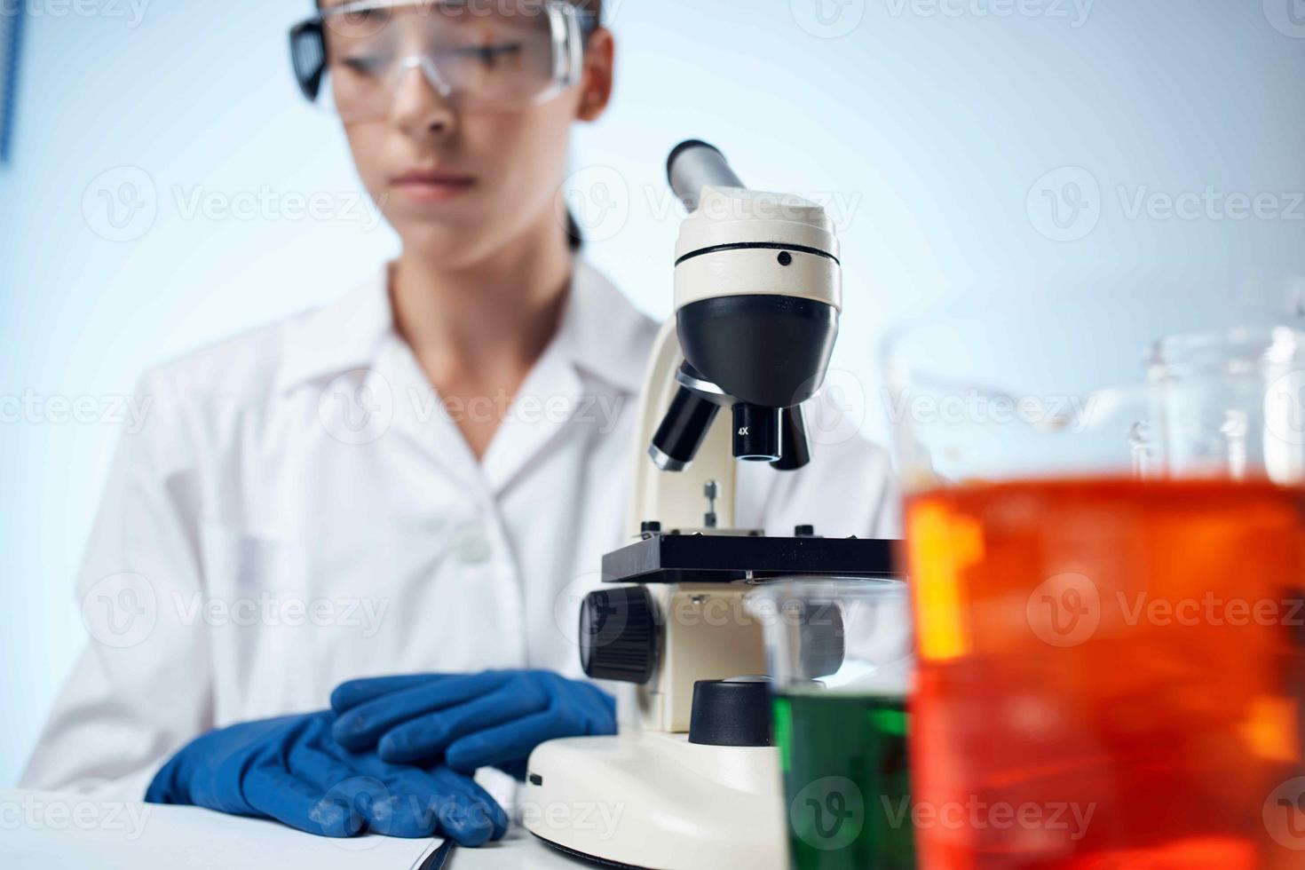 woman doctor medicine research microscope photo