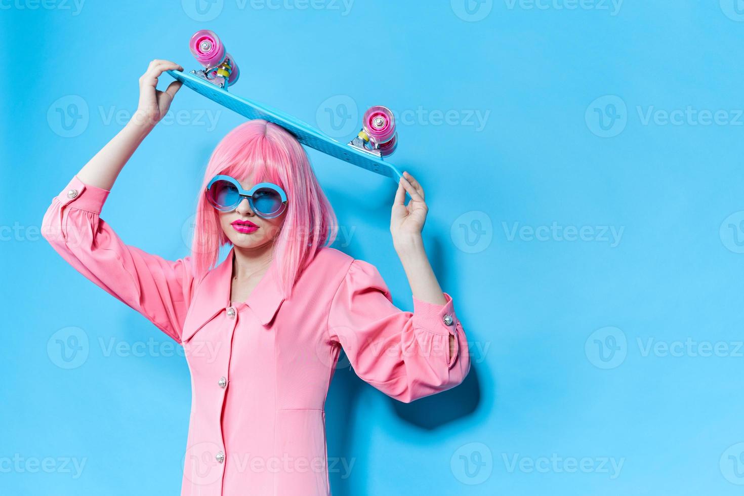 woman in sunglasses wears a pink wig studio model unaltered photo