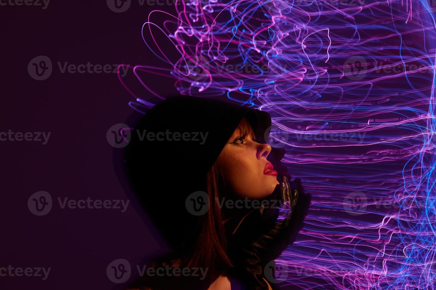 Pretty young female neon lines posing model glamor color background unaltered photo