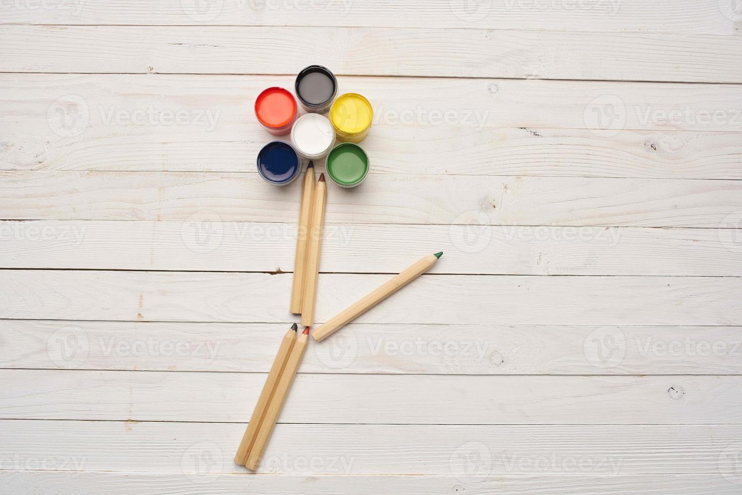 watercolor paints and pencils in the form of a flower photo