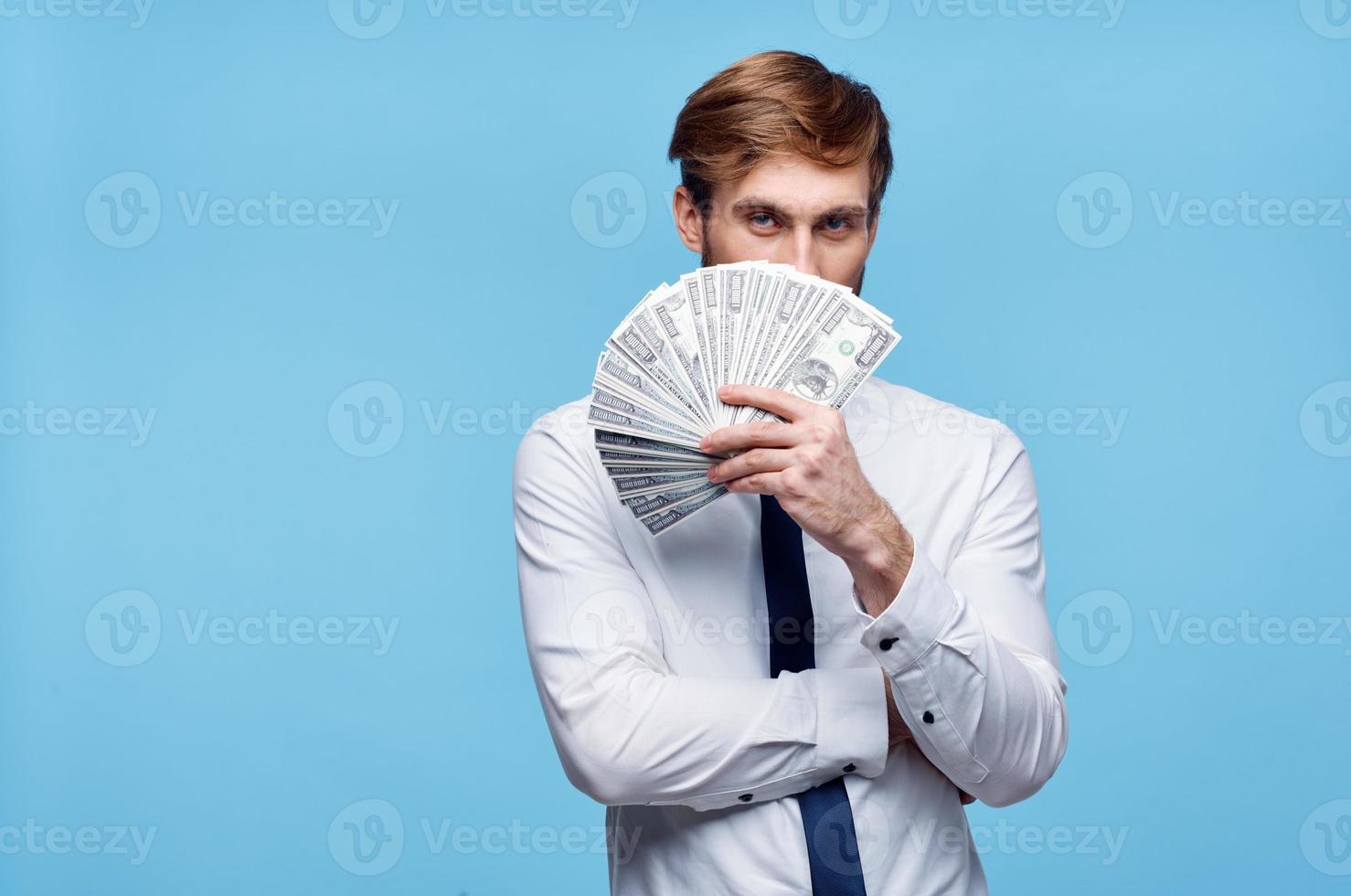 man in white shirt bundle of money wealth dollars finance photo