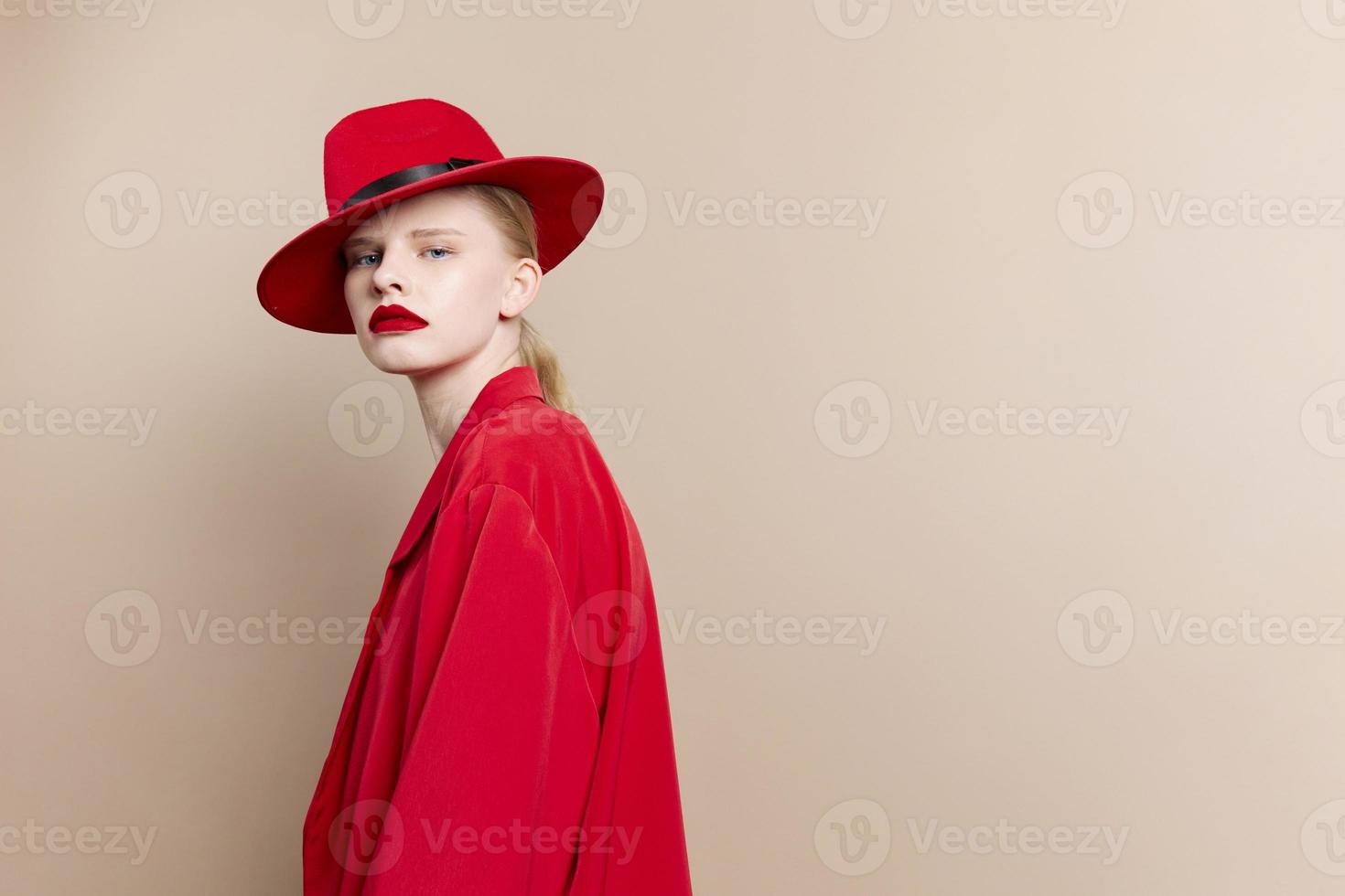 portrait of a woman red jacket and hat red lips fashion isolated background photo