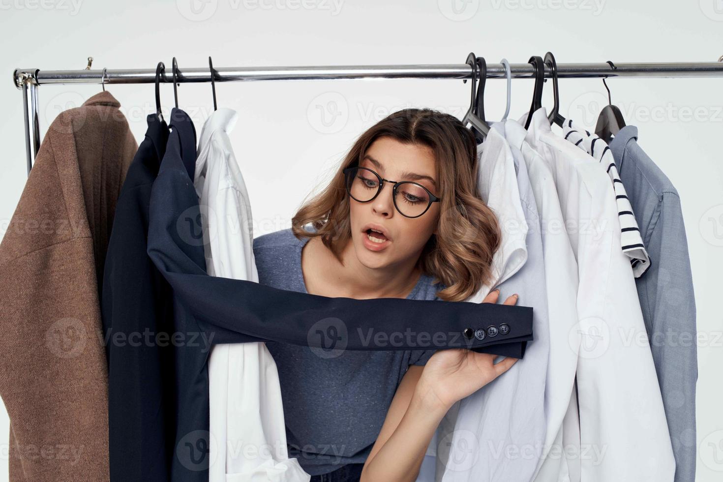 woman with glasses clothes hanger lifestyle shopping studio photo