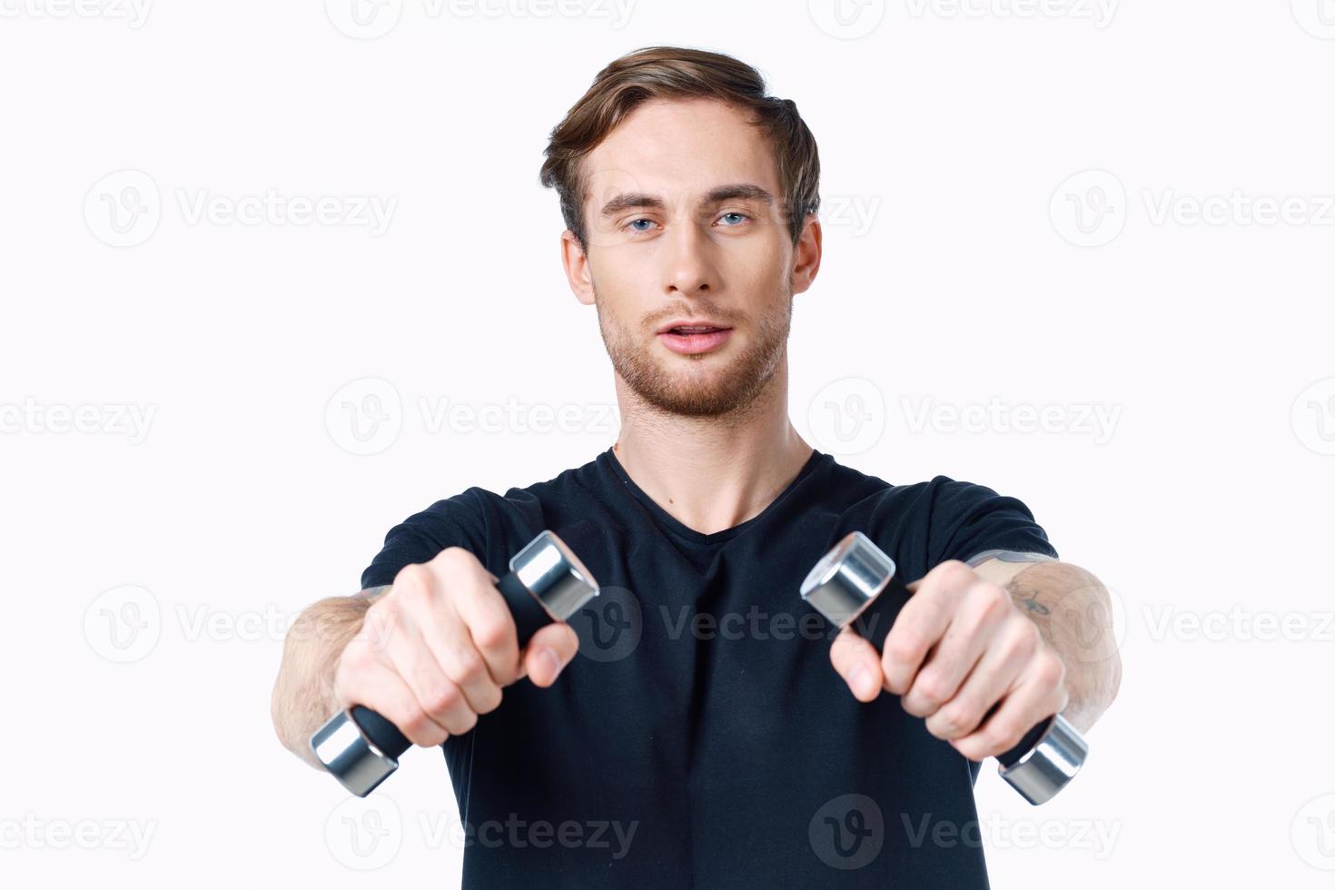 sporty young man with dumbbells on white background workout Copy Space photo