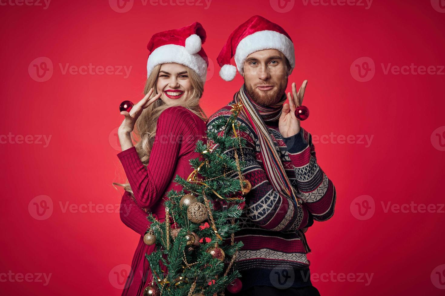 man and woman christmas holiday new year romance red background photo