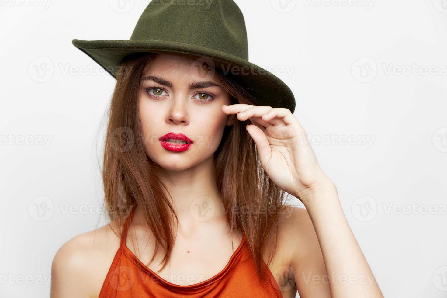 Portrait of a woman in a hat Red dress charm model attractive look photo