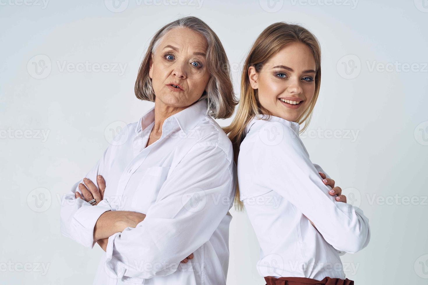 Mom and daughter in white shirts stand side by side emotion family love photo