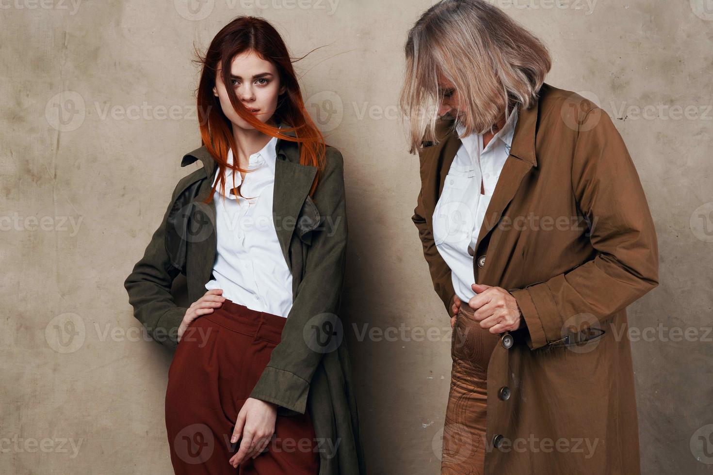 young and old woman are standing next to each other in a coat posing photo