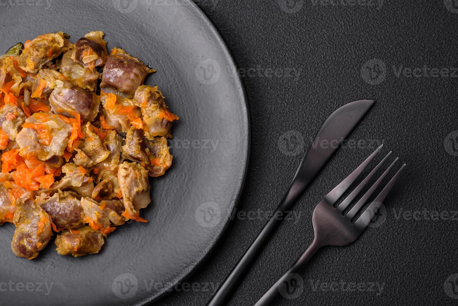 Delicious stewed chicken gizzards with carrots and tomato 22000140