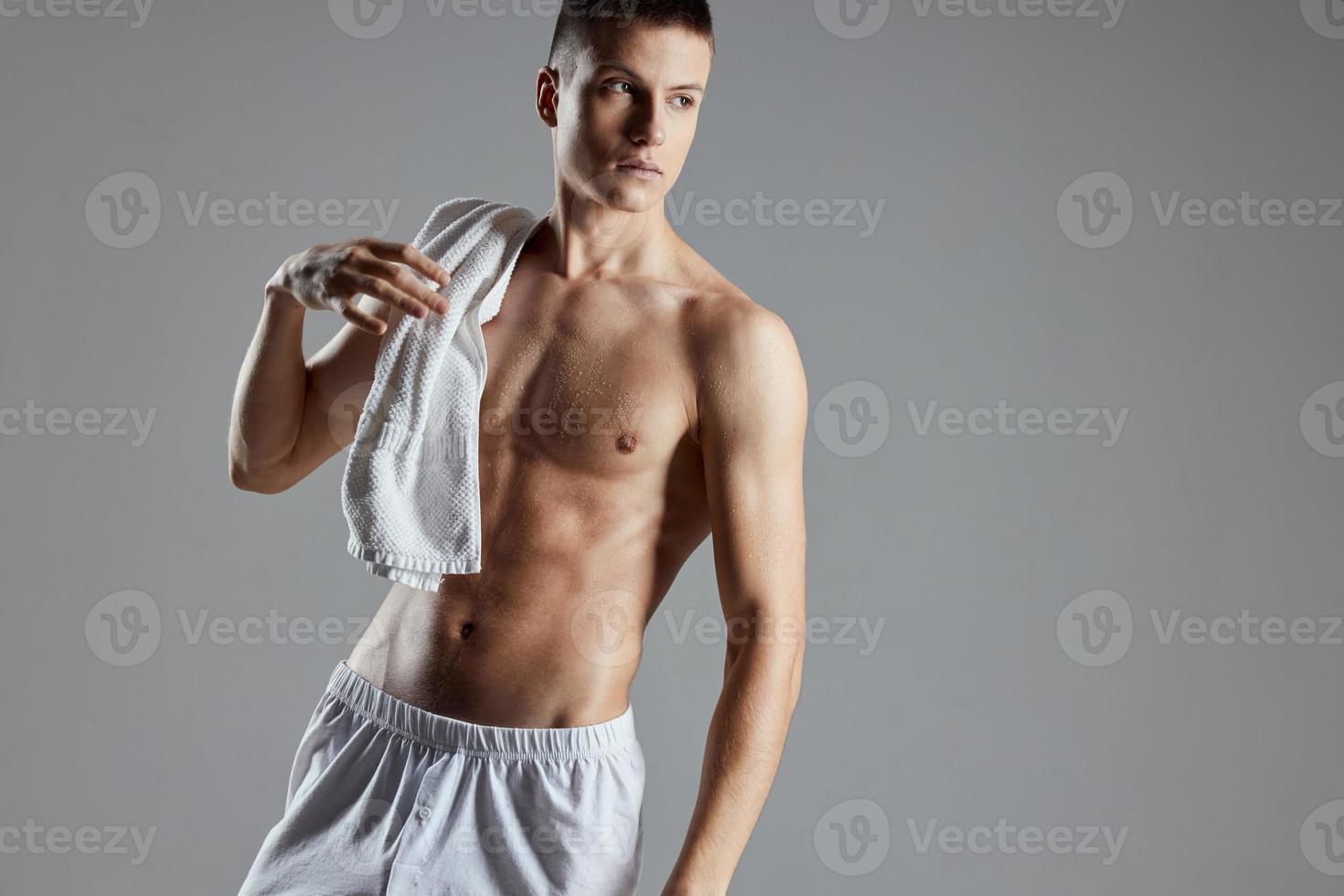 Athletic Guy Finish With Muscular Body Towel On Shoulders Cropped View Studio photo
