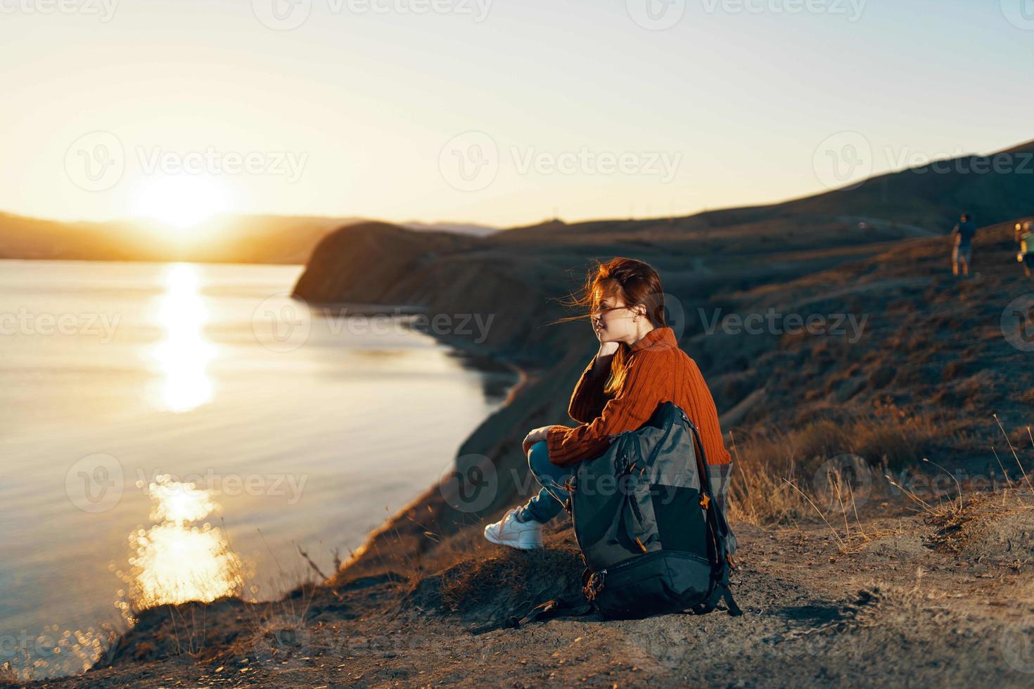 cheerful woman with backpack mountains travel freedom landscape photo