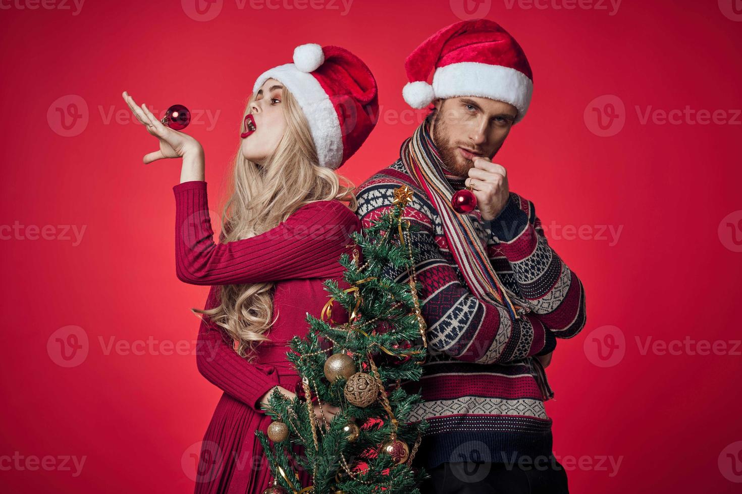 man and woman christmas holiday new year romance red background photo