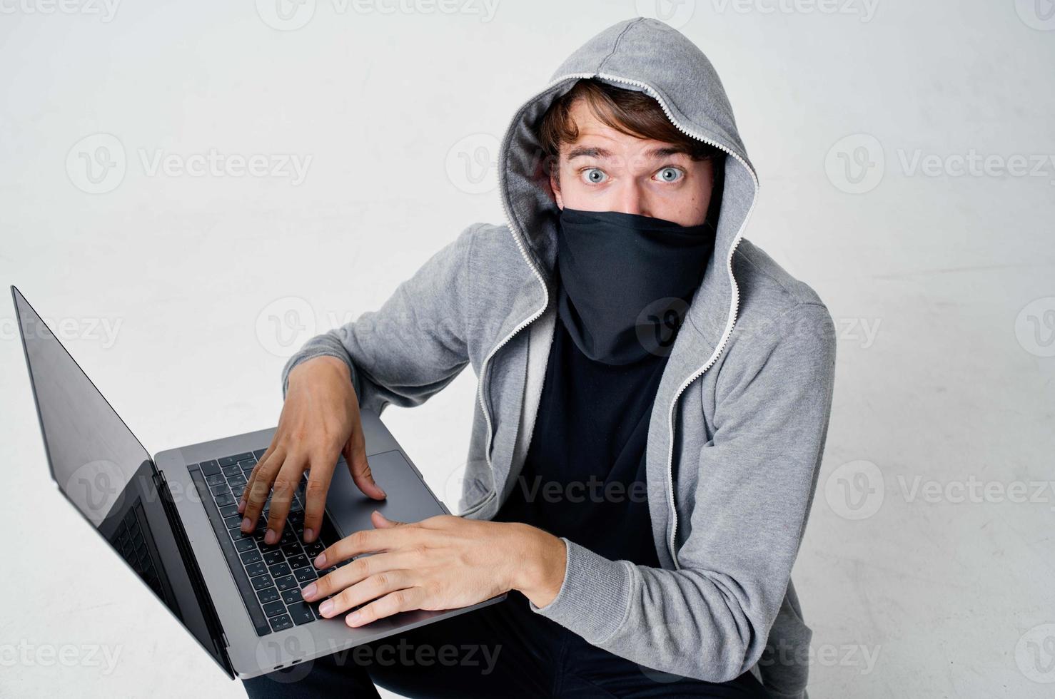 masked man crime anonymity caution balaclava isolated background photo