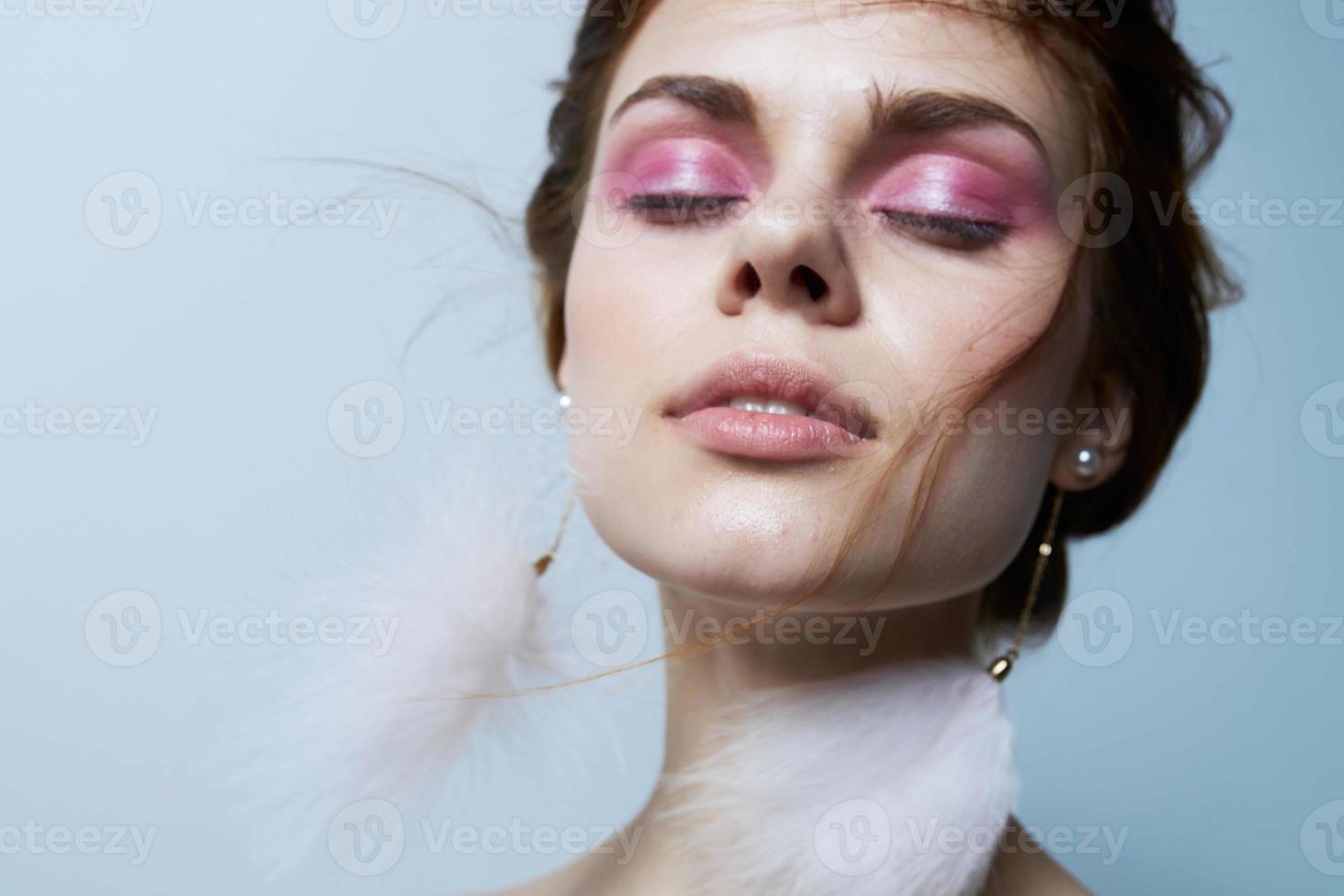 beautiful woman with closed eyes fluffy earrings cosmetics luxury jewelry photo