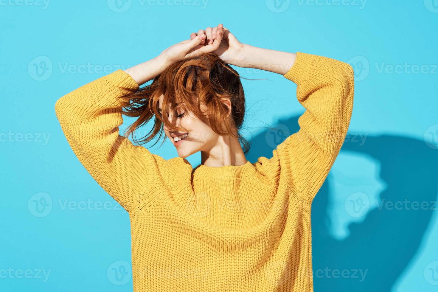 attractive woman in yellow sweater fashionable hairstyle emotions posing photo